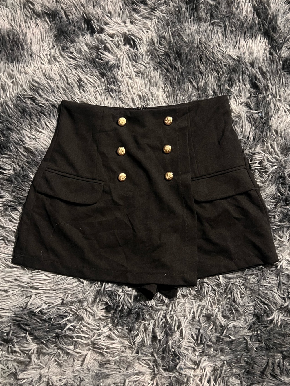 Black mini skort with gold buttons